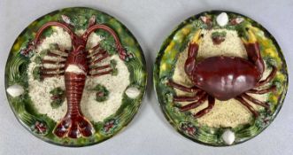 PAIR PALISSY STYLE WALL PLAQUES, relief decoration, crab and lobster, 30cm (diam.) Provenance: