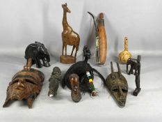 TRIBAL ART, including a hand-carved elephant mask, 36cms (h); Masai milk gourd with leather and