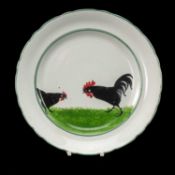 LLANELLY POTTERY SHUFFLEBOTHAM PLATE, black cockerel and hen, circa 1914, 24cms (diam.)