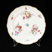 NANTGARW PORCELAIN MOULDED DESSERT PLATE circa 1813-1820, sprays of colourful summer flowers,