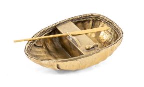 SILVER GILT MODEL OF A CORACLE, Garrard & Co, London 1957, with oar, the marks also including