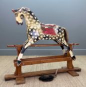 COLLINSON STYLE ROCKING HORSE, mounted on square pillars within safety stand, red swing irons,