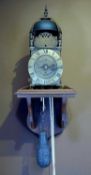 17TH C. BRASS LANTERN CLOCK, c. 1650-75, Nicholas Coxeter, the case surmounted by four turned