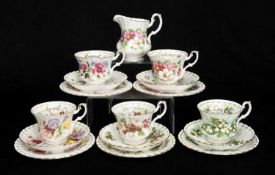 FULL SET OF 12 ROYAL ALBERT 'FLOWER OF THE MONTH' SERIES TRIOS, each decorated with a different
