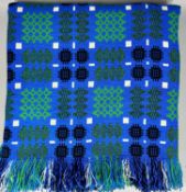 TRADITIONAL WELSH WOOLLEN BLANKET, in blues and greens with tasselled ends, 230 x 230cms Provenance:
