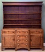 NORTH WALES DRESSER, early 19th century, boarded plate rack back with three shelves, breakfront base