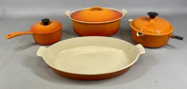 LE CREUSET orange enamel casserole dish, smaller oval casserole dish with cover, and two circular