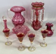 ASSORTED CRANBERRY GLASSWARE, including large jug with dimpled body, crimped rim, and clear