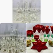 LARGE QUANTITY OF GLASSWARE, including decanters, bowls, and drinking ware, some coloured, contained