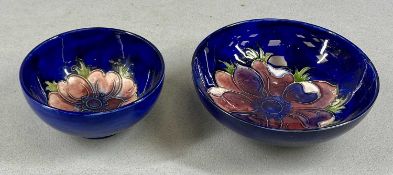 TWO CIRCULAR MOORCROFT ANEMONE BOWLS, impressed marks, 14.5 and 11cms (diam.) Provenance: private