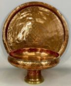BEATEN COPPER PEDESTAL BOWL, 14 (h) x 25cms (diam.), and an Arts & Crafts style copper charger,