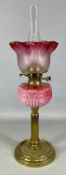 FINE VICTORIAN BRASS BASED OIL LAMP, having milk glass reservoir and cranberry glass etched shade