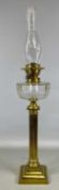 19TH CENTURY OIL LAMP, stepped square brass base and Corinthean column, faceted circular clear glass