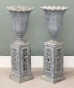 PAIR OF GALVANISED METAL GARDEN URNS of pineapple form, on pierced rectangular stands, 88cms (h)