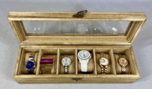 SIX STORM FASHION WATCHES, contained in wooden display case Provenance: private collection Conwy