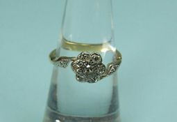 DIAMOND FLOWERHEAD CLUSTER RING, set in 18ct white and yellow gold, size L, 2.74g Provenance: