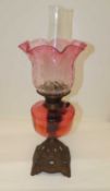 VICTORIAN CRANBERRY GLASS PEDESTAL OIL LAMP, with cast metal base, 58cms (h) Provenance: private