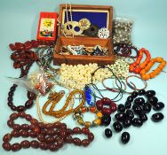 ASSORTMENT OF COSTUME JEWELLERY, including bakelite amber beaded necklaces, simulated pearls, etc.