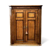 19TH CENTURY OAK TWO-DOOR FLAT FRONT CORNER CUPBOARD, cross banded in mahogany, brass escutcheons,
