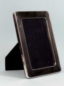 MODERN SILVER FACED PHOTOGRAPH FRAME, of plain rectangular design with rounded corners, dated