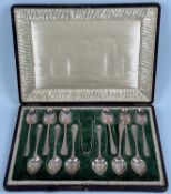 CASED SET OF TWELVE GEORGE V SILVER TEASPOONS & TONGS, handles with chased design, Walker & Hall
