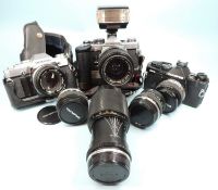 OLYMPUS OM-2N CAMERA with motor drive, flash gun, and auto zoom 70mms lens; together with Olympus