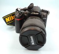 NIKON D7000 DIGITAL CAMERA, with Nikon DX18-105 f/3.5-5.6 lens Provenance: private collection