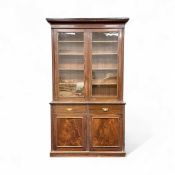 19TH CENTURY MAHOGANY CUPBOARD BOOKCASE, upper section with glazed double doors enclosing adjustable
