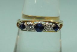 SAPPHIRE & DIAMOND FIVE-STONE RING, set in a modern 18ct gold split-shank mount, size O, 3.07g