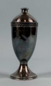 A SILVER SUGAR CASTER of baluster form, reticulated rim, Albert Edward Jones, Birmingham 1945, 17cms