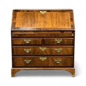 GEORGE III WALNUT BUREAU, cross banded in mahogany and inlaid with feather banding, fall front