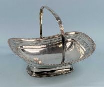 GEORGE III RECTANGULAR SILVER CAKE BASKET, with gadrooned border, frieze engraved with foliage and