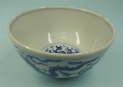 CHINESE BLUE & WHITE DRAGON BOWL with apocryphal Ming character mark, 10.5cms (diam.) Provenance: