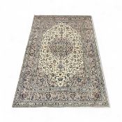 PERSIAN CREAM & BLUE GROUND HANDMADE WOOL RUG, 376 x 247cms Provenance: private collection Conwy
