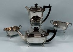 GEORGE V SILVER FOUR-PIECE TEA SERVICE of plain octagonal form, comprising teapot and hot water