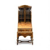 WALNUT BUREAU BOOKCASE, glazed double doors enclosing adjustable shelf-lined interior, fall front