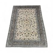 KASHAN BLUE & CREAM GROUND HANDMADE WOOL RUG, 355 x 247cms Provenance: private collection Conwy