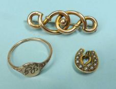 9CT GOLD KNOT BROOCH with steel pin, 2.4g; together with 18ct gold horseshoe stock pin head, inset