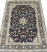 PERSIAN BLUE GROUND HANDMADE WOOL RUG, 382 x 279cms Provenance: private collection Conwy