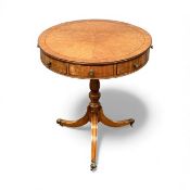 19TH CENTURY SATINWOOD DRUM TABLE, quarter veneered and cross banded top over four real and four