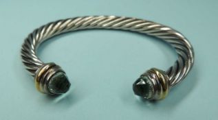 DAVID YURMAN STERLING SILVER & 14CT GOLD CABLE BANGLE, with faceted probably morganite terminals,