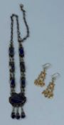 PAIR OF SAUDI ARABIAN YELLOW METAL FILIGREE PENDANT EARRINGS, and Afghan tiered white metal and