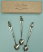 THREE DANISH STERLING SILVER SPOONS by Anton Hansen (c. 1952-1980), each with animalia terminal,