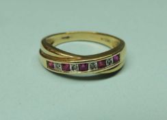 RUBY & DIAMOND CROSSOVER HALF-ETERNITY RING in 9ct gold, size P, 3.33g Provenance: private