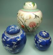 THREE CHINESE GINGER JARS, comprising famille rose decorated with peony and birds, double blue