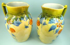 PAIR OF MINTONS SECESSIONIST WATER JUGS, decorated with an oranges pattern, impressed marks, 30.5cms