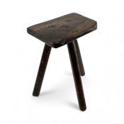 WELSH ELM & ASH MILKING STOOL, 19th century, shaped rectangular slab seat, raised on three shaped