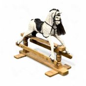 MODERN DAPPLE GREY ROCKING HORSE, on natural wood stand, 109 (h) x 136 (w) x 54cms (d) Provenance: