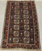 BALUCH RED GROUND RUG, 210 x 121cms Provenance: private collection Gwynedd