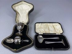 CASED SILVER CHRISTENING SET, comprising egg cup, spoon and serviette ring, Sheffield 1927/28, and